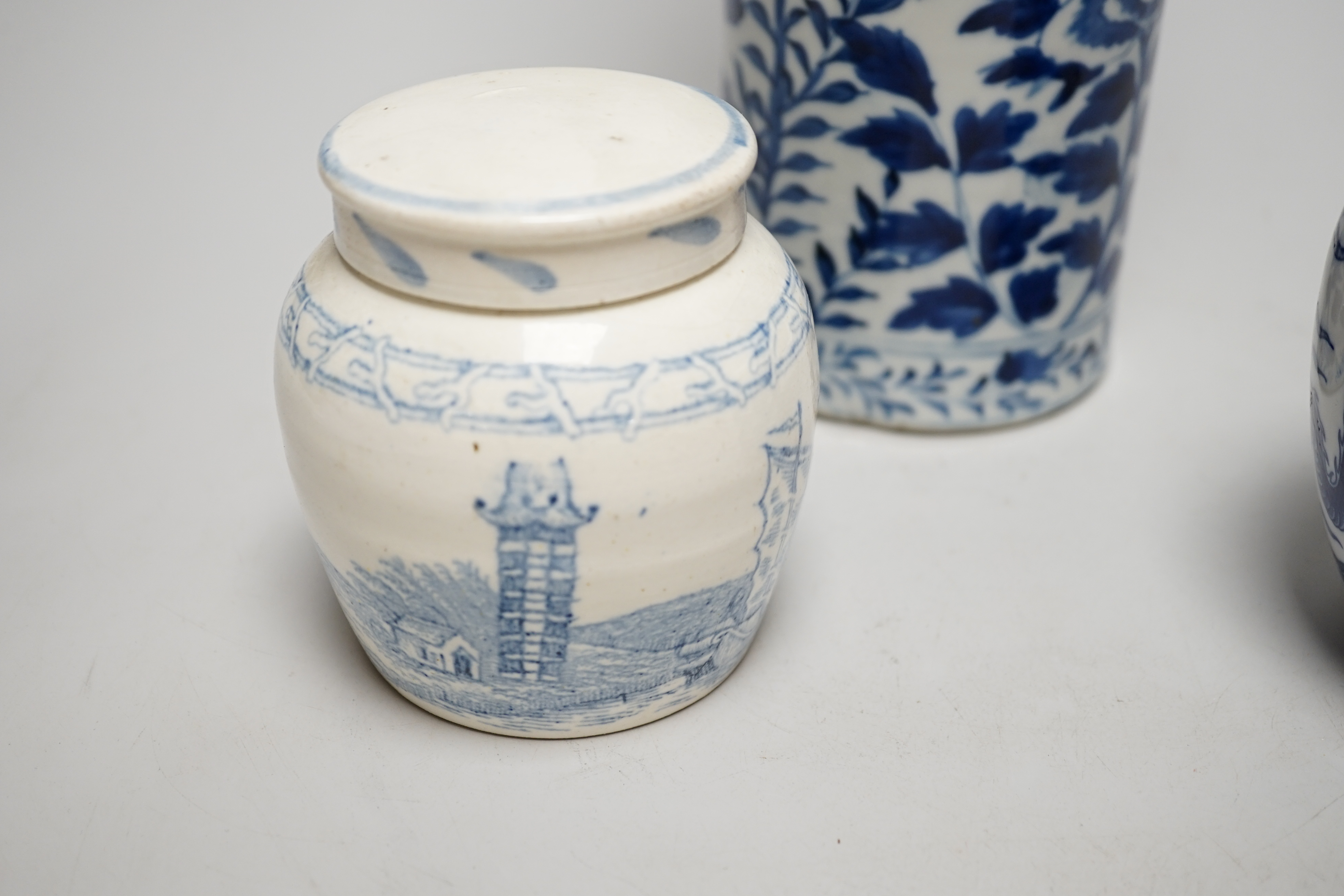 An early 20th century Chinese vase together with two small jars with covers, highest 31cm
